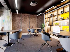 a conference room with tables and chairs and a laptop at IBIS LAGOS LEKKI in Lagos