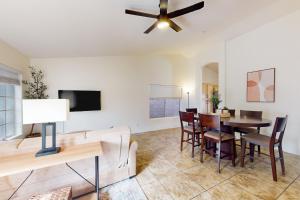 a living room with a couch and a table at Suitewater in Peoria +31 photos