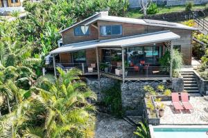 an aerial view of a house on a hill at Villa TheOceane in Les Avirons