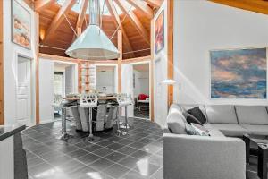 a living room with a couch and a table at FY144-Middelfart-Vegavej-40 in Middelfart