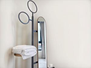 a bathroom with a mirror and a towel rack at ZJ Villa in Sanxing +12 photos