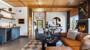 a living room with a couch and a table at Cascade Crest by AvantStay in Bend