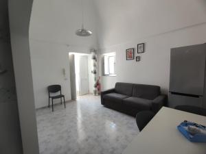 a living room with a couch and a chair at Casa Francesca Ponza in Ponza