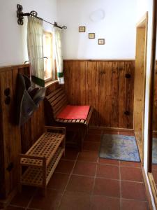 a room with a sauna with a bench and a window at Romantikzimmer Jakobbauer in Turnau