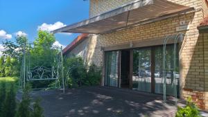 an entry to a house with a glass door at Kernavės centras in Kernavė
