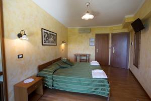 Postel nebo postele na pokoji v ubytování Hotel Internazionale