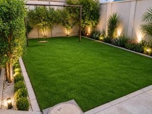 an artificial lawn in a garden with a goal at Shelton Royal Hotel in Multan