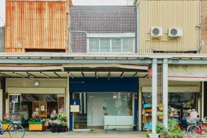 a group of buildings in a city with a store at まちの別邸 緝 shu in Kochi