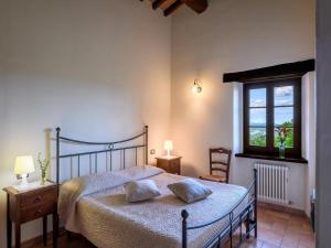 a bedroom with a bed with two pillows on it at Apartment in Sant'Angelo near Medieval Town in SantʼAngelo in Vado