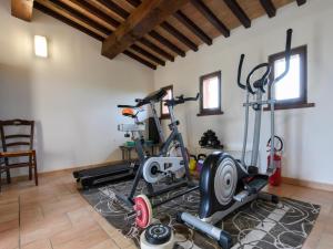 a gym with two exercise bikes in a room at Apartment in Sant'Angelo near Medieval Town in SantʼAngelo in Vado
