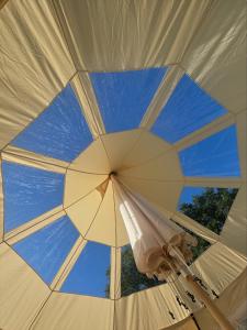 a view of the ceiling of a large umbrella at Sunset Tent in Sageau