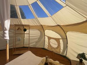 a large tent with the inside of it at Sunset Tent in Sageau +6 photos