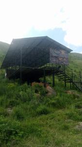 a large building in the middle of a field at KochevniK in Almaty