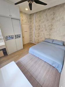a bedroom with a bed and a ceiling fan at Large Group KTV Stay, Near Setia Alam, Klang in Klang +18 photos