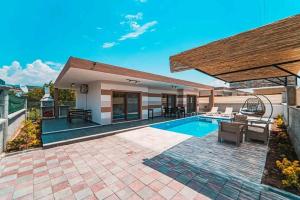 a backyard with a swimming pool and a house at VİLLA Terasa in Fethiye