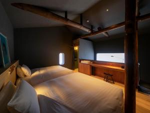 a large bedroom with two beds and a desk at MU HEN KO Q -Nara- in Nara +20 photos