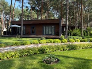 a small house in the middle of a yard at Grace Place in Soshnikov +51 photos
