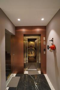 a elevator in a building with a motorcycle on the wall at Hotel Shivora in Bathinda +9 photos