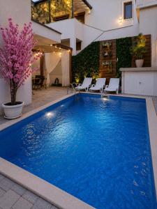 a large blue swimming pool in a house at Villa Diamond in Mostar