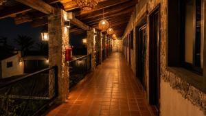 an empty hallway of a building at night at La Peña Hotel Boutique & SPA in Cuetzalán del Progreso