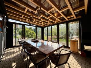 a large dining room with a table and chairs at Billy&Ane Apartments,Rooms in Sinaia