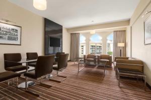 a waiting room with a table and chairs at Ramada Colombo in Colombo