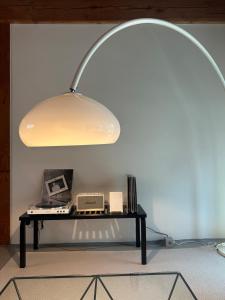 a desk with a lamp on top of it at Stay Jian in Daegu