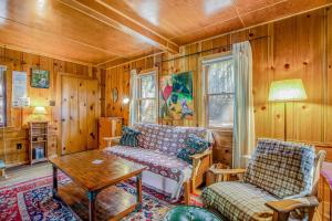 a living room with a couch and a table at Walden in the Woods in Idyllwild