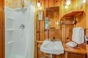 a bathroom with a white sink and a shower at Walden in the Woods in Idyllwild