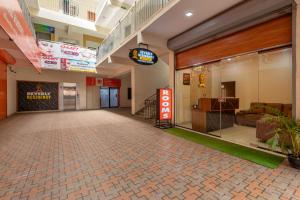 an empty lobby of a hospital with a waiting room at Hotel Beverly Residency - Near Nileshwar Railway Station in Nīleshwar
