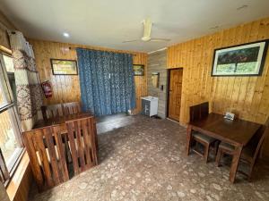 a room with a table and chairs and a dining room at ROYALE PEAKS villa sonamarg Rd in Harganyiwan +13 photos
