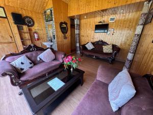 an overhead view of a living room with couches at ROYALE PEAKS villa sonamarg Rd in Harganyiwan