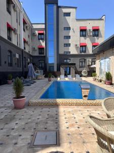 a swimming pool in the middle of a building at Hotel Dera Bukhara in Bukhara