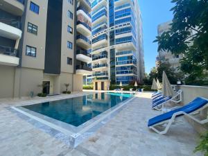 a swimming pool in the middle of a building at Rubin residence in Alanya