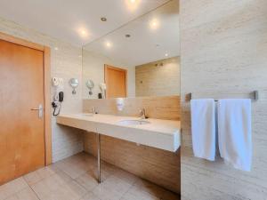 a bathroom with a sink and a mirror at Hotel Faranda Marsol Candas, Ascend Hotel Collection in Candás +56 photos
