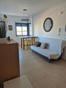 a living room with a couch and a table at Aire de Levante in Alicante