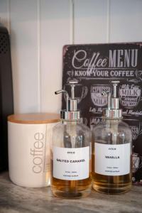 two glass bottles sitting on top of a counter at Fall Getaway|Crystal Beach Passes|Hottub|FirePit in Fort Erie