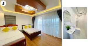 a hotel room with a bed and a bathroom at Highlights Taal Lake View Resort in Santol