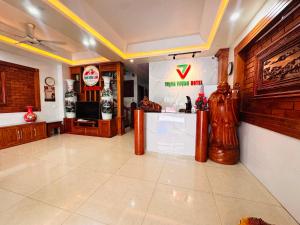 a lobby with a counter in a room with at Thịnh Vượng Hotel in Dong Hoi