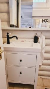a bathroom with a white sink and a mirror at Csendliget Villas Abádszalók in Abádszalók +31 photos