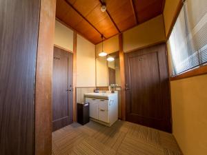 a small bathroom with a sink and a mirror at Gallery NICO Osaka Yao in Yaochō +18 photos