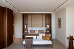 a hotel room with a bed and a couch at Keyla Hotel & Beach - Adult Only in Antalya
