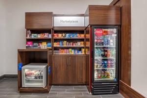 a refrigerator and a drink cooler in a store at Comfort Suites Hattiesburg near University in Hattiesburg