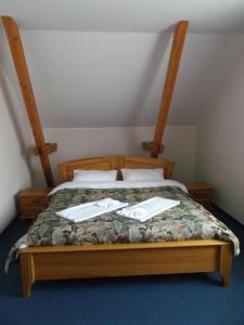 Postel nebo postele na pokoji v ubytování Hotel Tukums