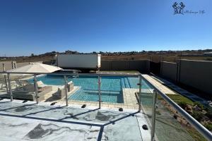 a swimming pool on top of a house at Holiday Villa Marondera in Marondera