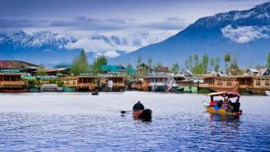 a group of people in a boat in the water at Younis Guest house in Srinagar