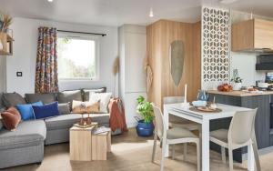 a living room with a couch and a table at U FARNIENTE in Bonifacio
