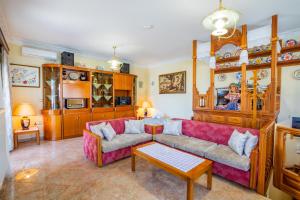 a living room with a couch and a table at Spacious 2BR Apartment with Balconies in Karpathos