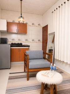 a living room with a couch and a table at 1BDM Aptmt Free Wifi,TV, NETFLIX,FRIDGE,KITCHEN-busy area in Dar es Salaam