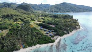 an aerial view of an island with tents and the ocean at Bungalow 6 'Mata'i' in Parea